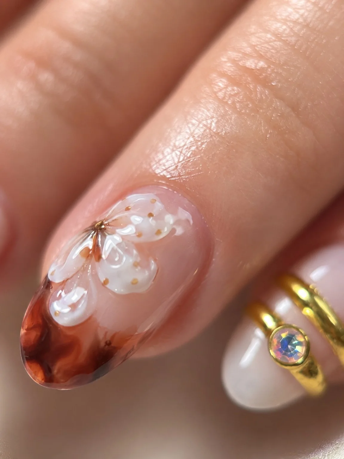Macro amber floral nail art detail by Marzieh Nail Atelier